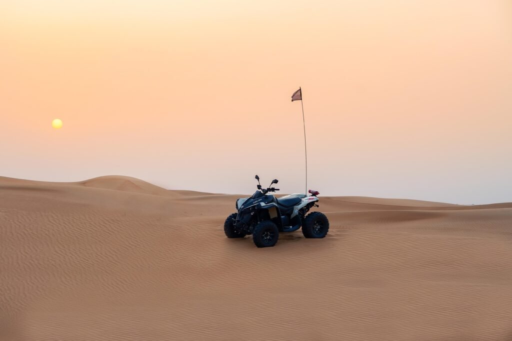 Rental Can Am Quad bike parked in Dubai desert at susnet