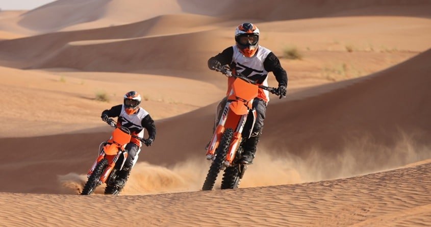 2 KTM dirt bike riders in dubai desert
