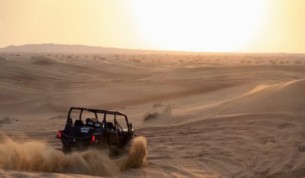 dune buggy bashing through the sand